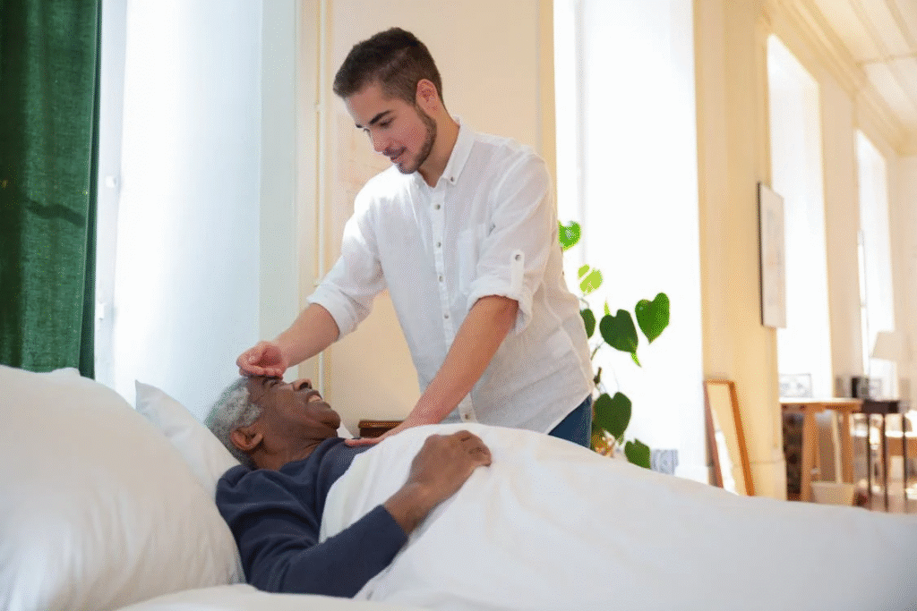 A person working alongside an old person.