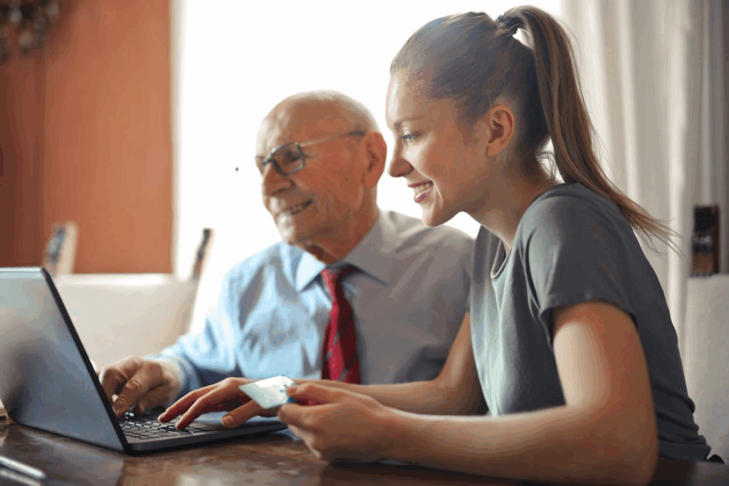 An image of a caregiver helping a man with his tasks