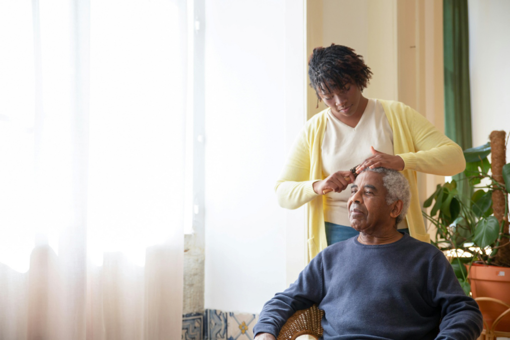 A caregiver brushing a senior's hair