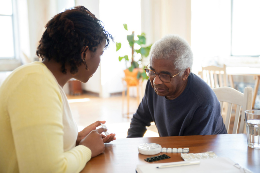 A caregiver talking to a senior