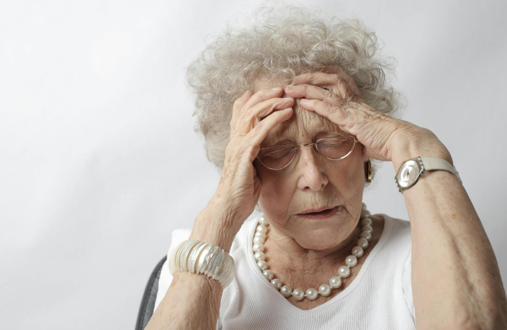 A senior woman stressed