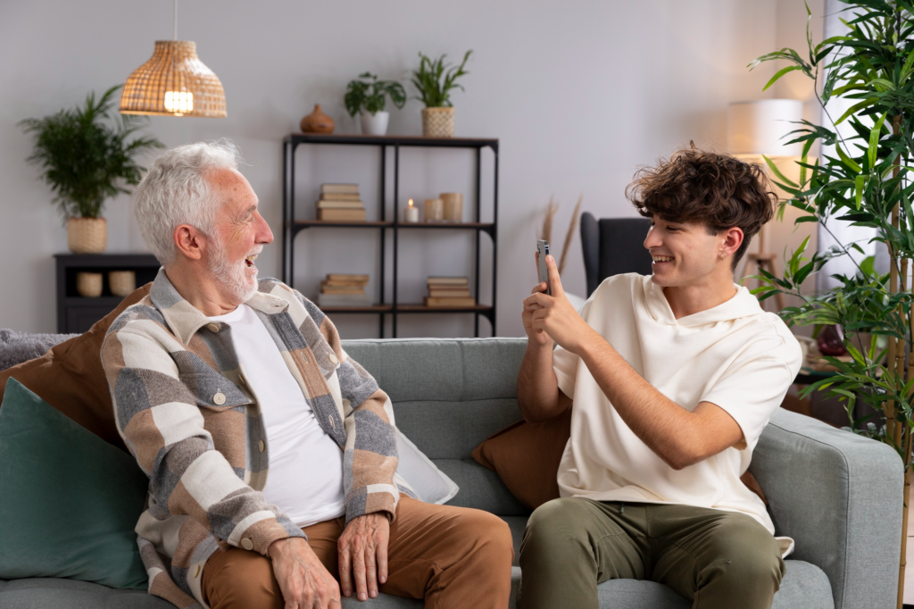 A caregiver taking the picture of an elderly person