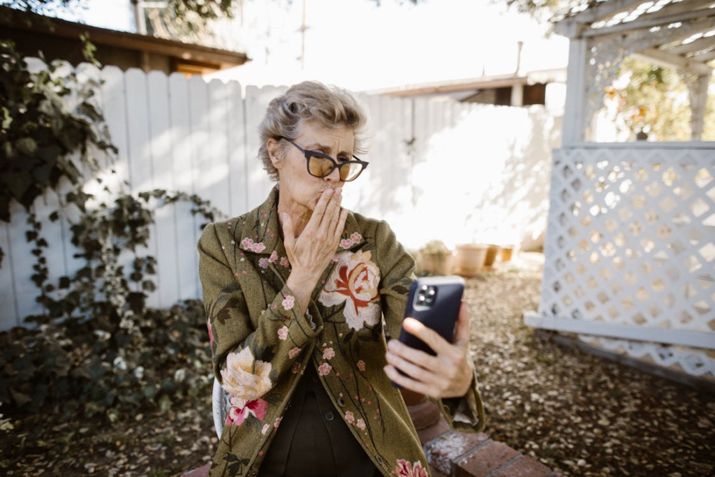 An old woman is talking on a video call
